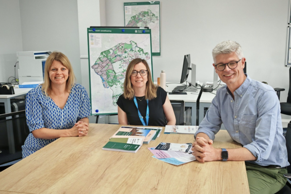 MP sitting with charity representatives