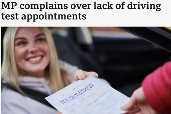 Young woman getting passed her driving certificate
