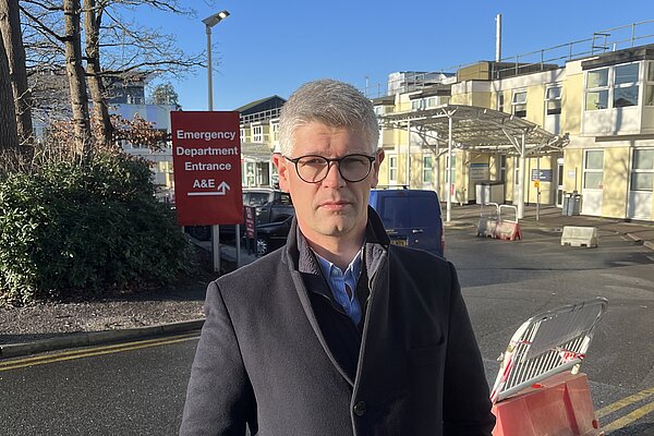 Al standing outside Frimley Park Hospital